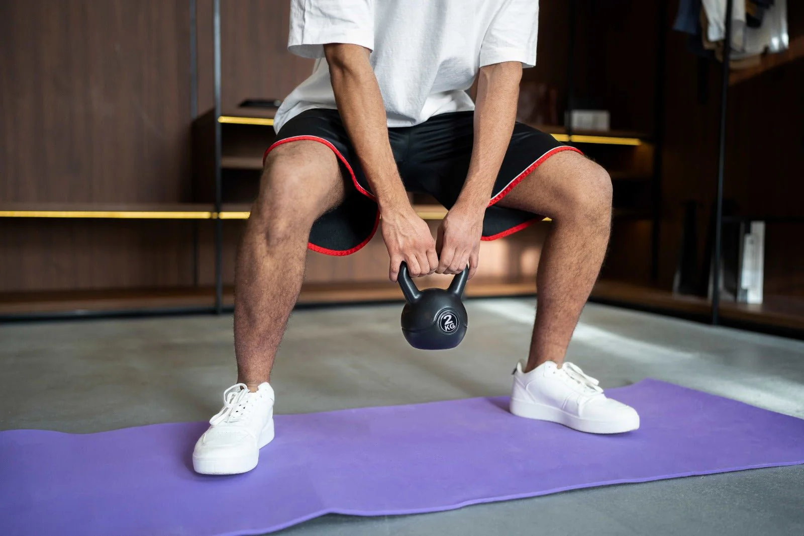 man-training-with-kettlebell-mat_1-855329