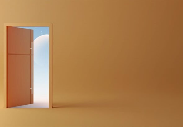 An open door revealing a bright blue sky with a white sphere